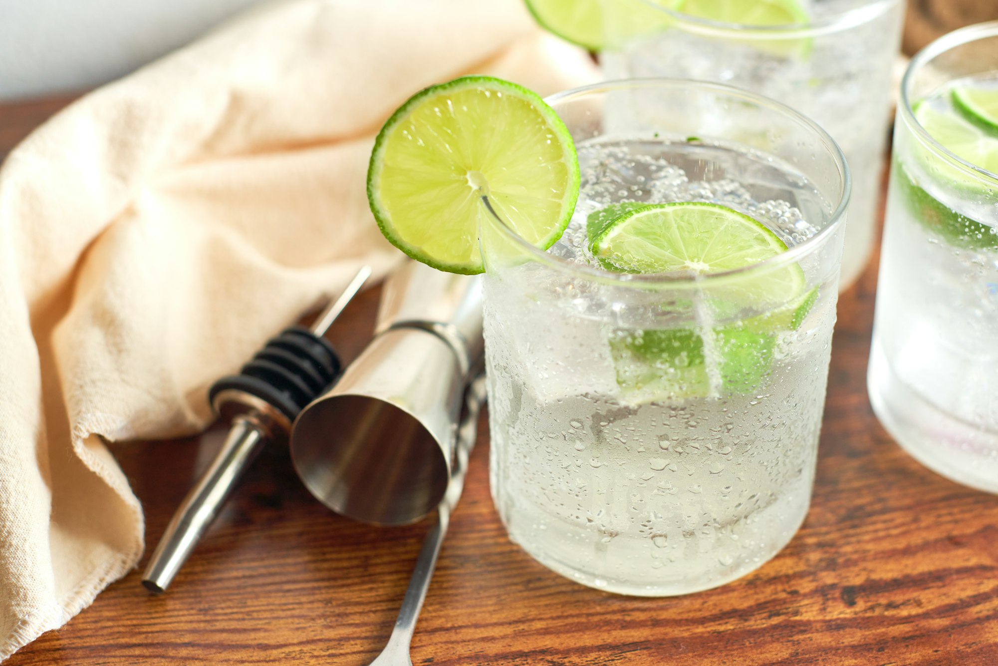 Three glasses of a freshly prepared gin and tonic
